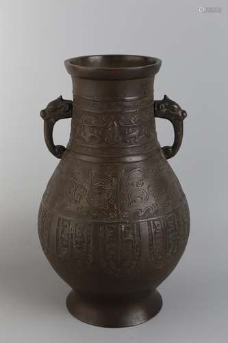 A BRONZE VASE WITH BEAST HANDLE