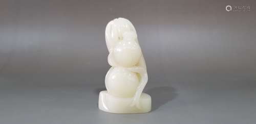 A CARVED HETIAN JADE GOURD