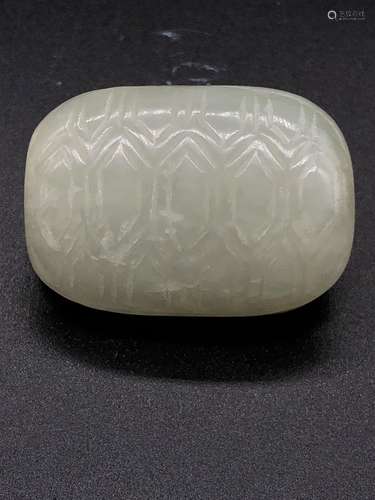 AN ARCHAIC JADE PLAQUE