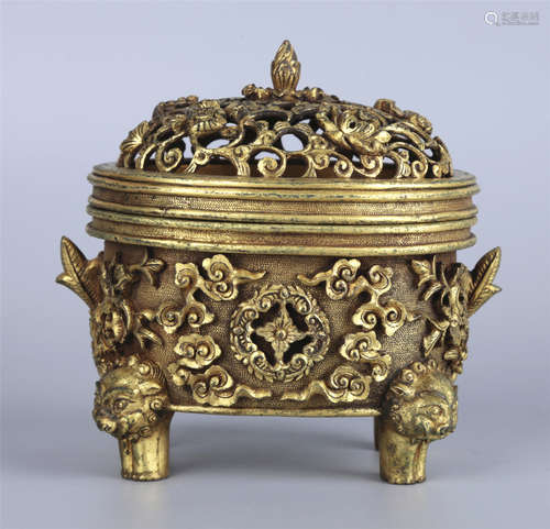 A GILT BRONZE BURNER