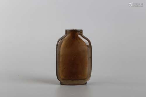 A BROWN GLASS SNUFF BOTTLE