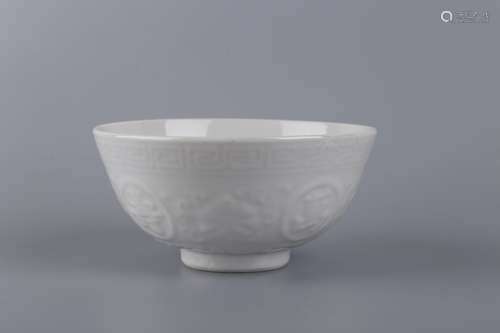 A WHITE GLAZED BOWL