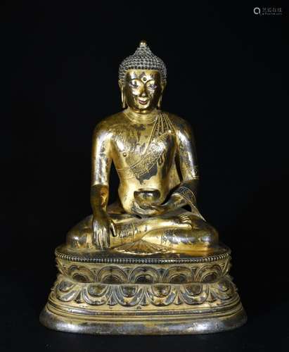 A GILT-BRONZE FIGURE OF SHAKYAMUNI