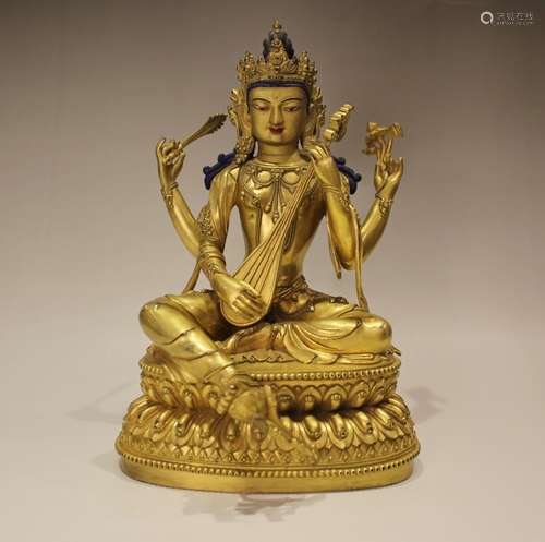 A GILT-BRONZE FIGURE OF MUSICAL BUDDHA