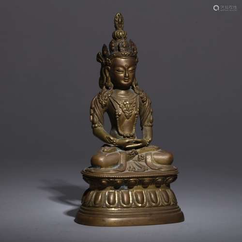 A BRONZE SEATED FIGURE OF GUANYIN