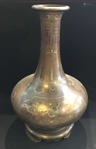 A PARCEL-GILT BRONZE VASE