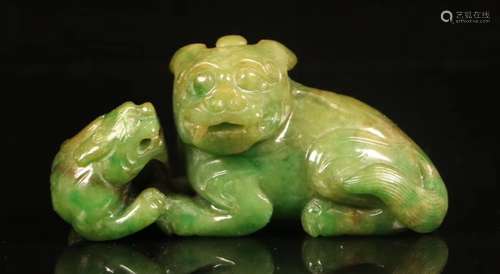 A GREEN JADE CARVED ORNAMENT