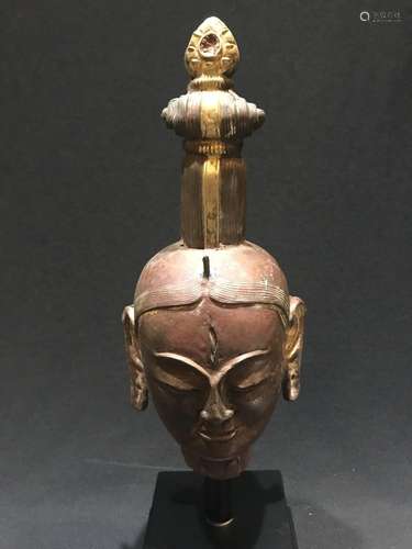 A BRONZE HEAD OF BUDDHA