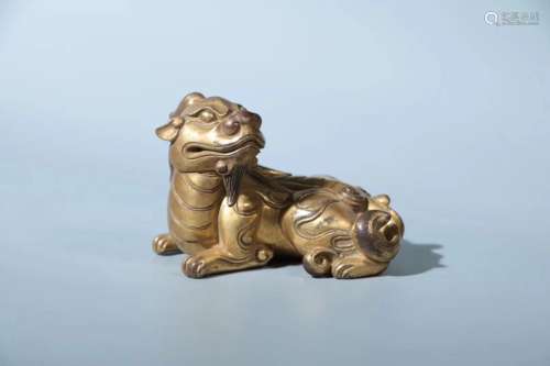 A GILT-BRONZE 'BEAST' PAPER WEIGHT