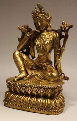 A GILT-BRONZE FIGURE OF TARA