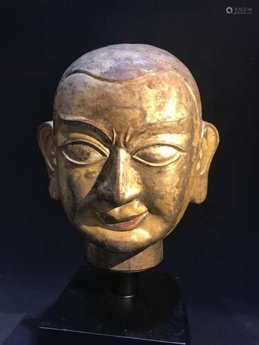 A GILT-BRONZE HEAD OF LAMA