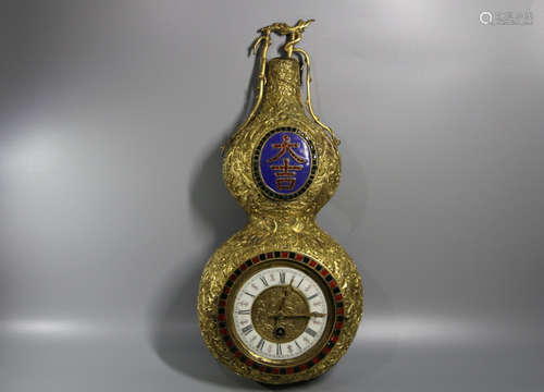 A GILT-BRONZE GOURD-FORM CLOCK