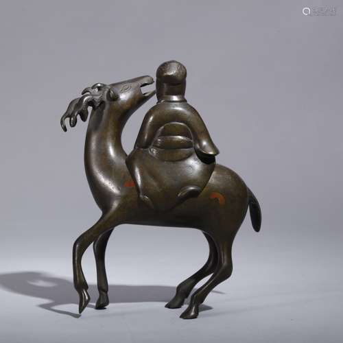 A BRONZE FIGURE OF A MAN RIDING A DEER