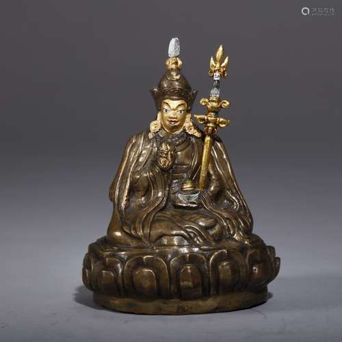 A TIBET GILT-BRONZE FIGURE OF LAMA