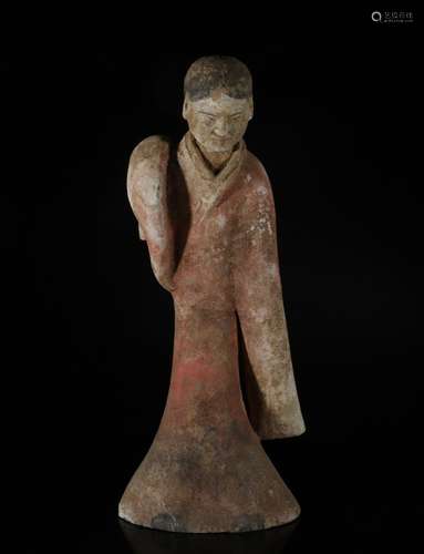 A POTTERY FIGURE OF LADY