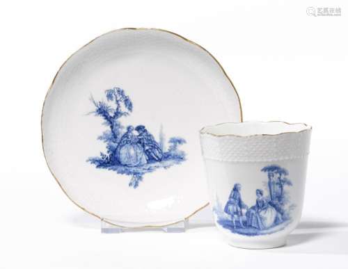 BEAKER AND SAUCER WITH WATTEAU PAINTING IN BLUE CAMAÏEU,