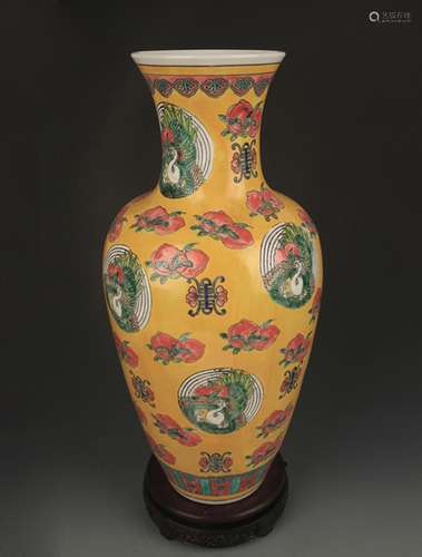 A YELLOW GLAZE FAMILLE ROSE GUAN YIN VASE