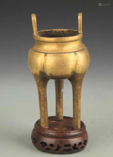 A BRONZE TRIPOD FOOT CENSER