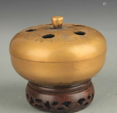 A BRONZE ROUND AROMATHERAPY BURNER