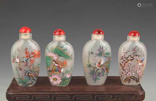 SET OF FOUR FLOWER AND BIRD PAINTED GLASS SNUFF BOTTLE