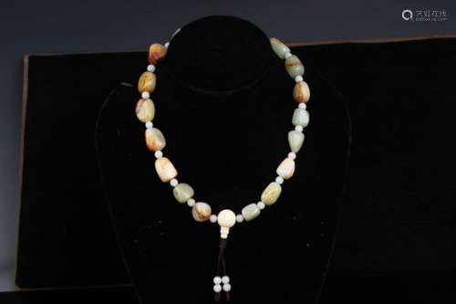 A FINE RAW JADE NECKLACE