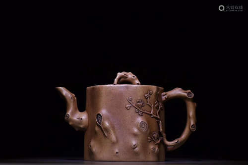 A PLUM STUMP DESIGN PURPLE CLAY TEAPOT