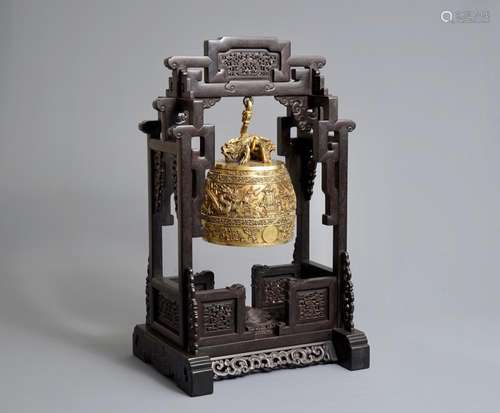 A Chinese gilt bronze bell in zitan suspension frame, Qianlong mark, 18/19th C.