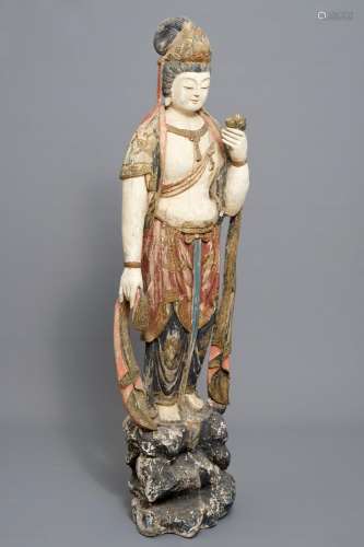 A tall Chinese painted and carved wood figure of Guanyin, 18/19th C.