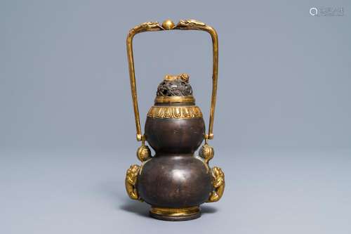 A Chinese parcel-gilt bronze double gourd hanging censer and cover, Kangxi mark, Qing