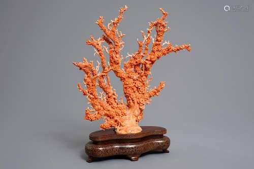 A Chinese carved red coral 'blossom tree' group on inlaid wooden stand, 19/20th C.