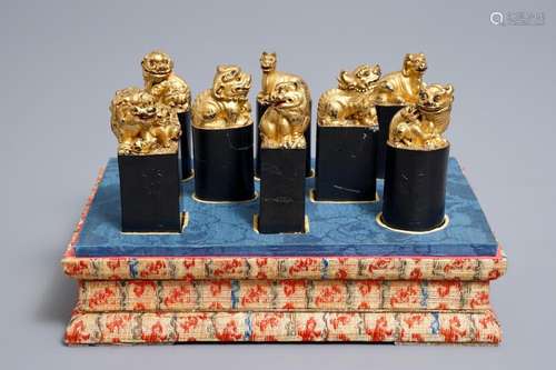 Eight Chinese parcel-gilt ink stones shaped as seals in display box, 18/19th C.