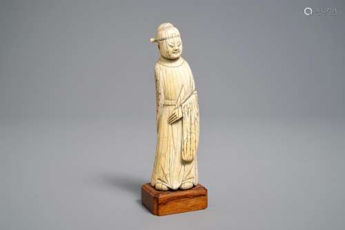 A Chinese carved ivory figure of a scholar, Ming