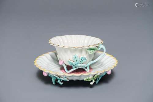 A Chinese famille rose lotus-shaped relief-decorated cup and saucer, Yongzheng
