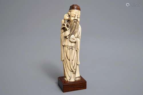 A Chinese Ming-style carved ivory figure of a scholar, 19th C.