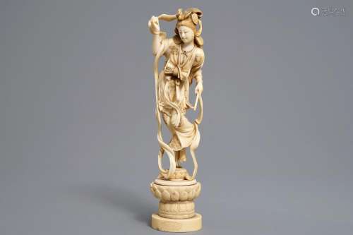 A Japanese carved ivory figure of a lady with a drum on a lotus throne, Meiji, 19th C.