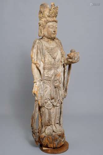 A tall Chinese carved wood figure of Guanyin, Ming