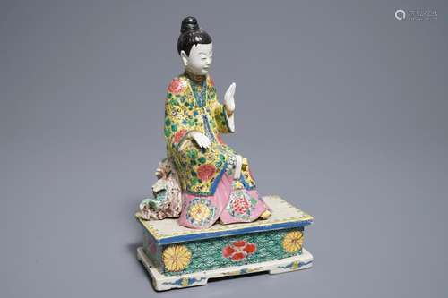 A Chinese famille rose model of a seated lady, Yongzheng