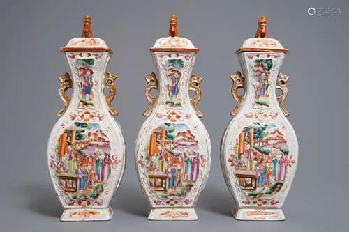 Three Chinese famille rose 'mandarin' vases and covers, Qianlong