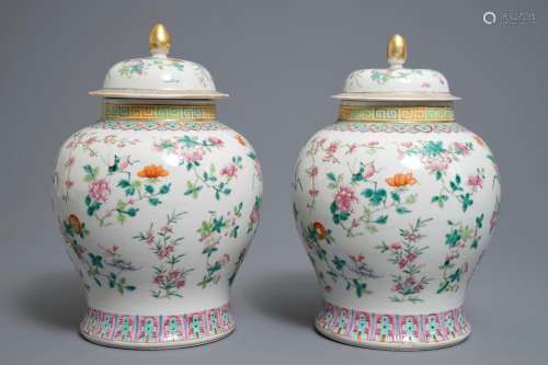 A pair of Chinese famille rose vases and covers with flowers and insects, 19th C.