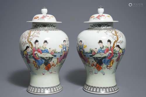 A pair of Chinese famille vases and covers, Qianlong mark, 20th C.