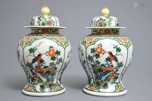 A pair of Chinese famille verte vases and cover with birds and flowers, 19th C.