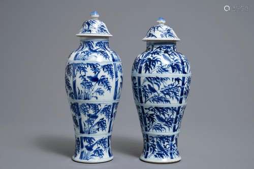 A pair of Chinese blue and white vases and covers with birds on bamboo branches, Kangxi