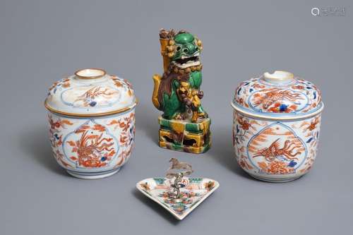 A pair of Chinese Imari-style bowls and covers, a heart-shaped famille verte saucer and a sancai lion, Kangxi