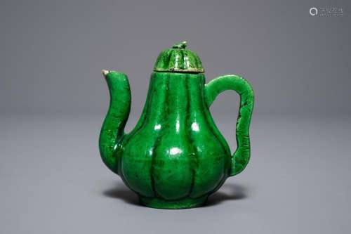 A small Chinese verte biscuit 'Chrysanthemum' teapot and cover, Kangxi