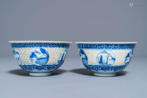 A pair of Chinese blue and white reticulated bowls with landscape panels, Transitional period
