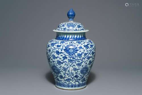 A tall Chinese blue and white 'lotus scroll' vase and cover, Kangxi