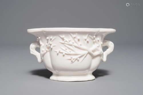 A Chinese quatrefoil blanc de Chine two-handled wine cup, Kangxi