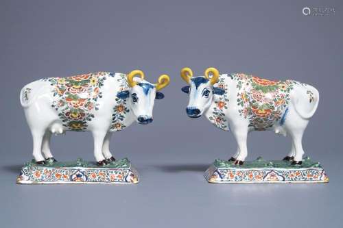 A pair of polychrome Dutch Delft models of cows on bases with frogs, 18th C.