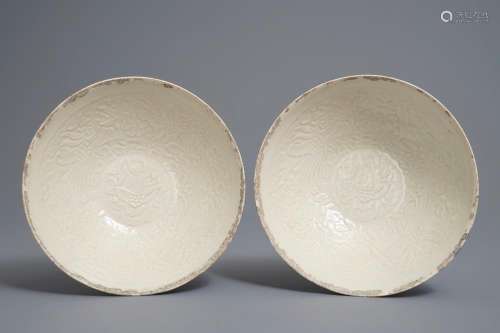 A pair of Chinese qingbai moulded 'phoenix' bowls, Song