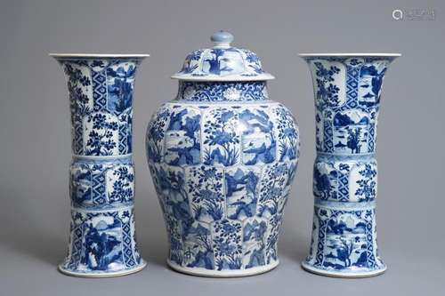 A large Chinese blue and white three-piece garniture with landscape and floral panels, Kangxi